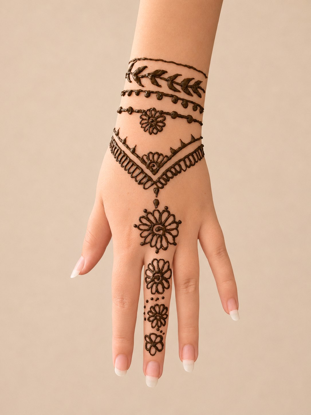 Stacked henna bracelet bands with a pendant flower dropping onto the hand