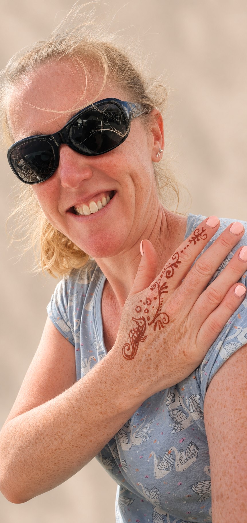 Happy customer showing her seahorse henna in developed next-day colour