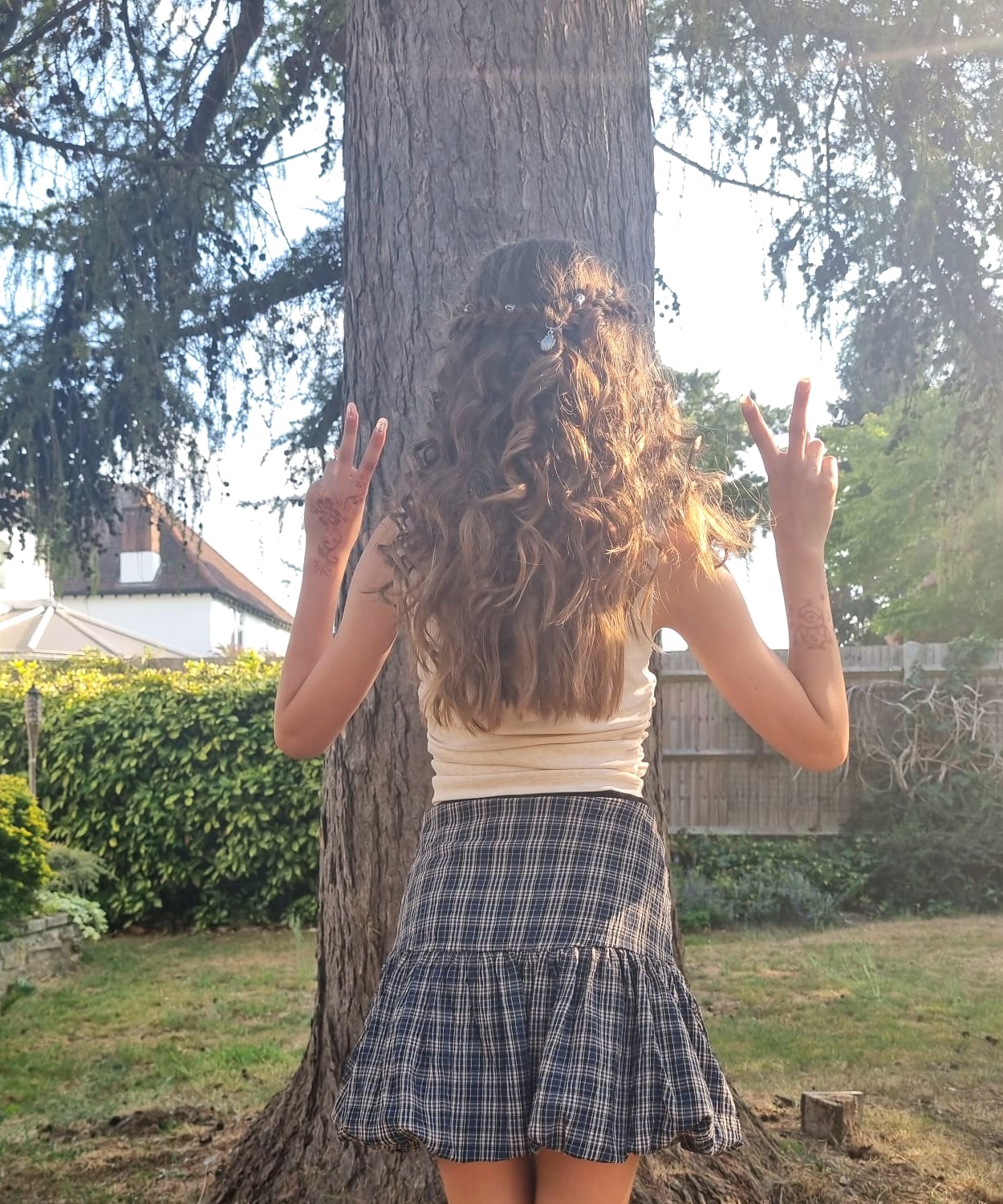 Boho half-up style with loose waves and hair gems